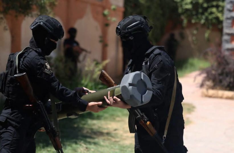 Members of Syria's Interior Ministry display one of the missiles seized during an operation targeting an alleged cross-border weapons smuggling network near al-Tanf, July 16, 2026.