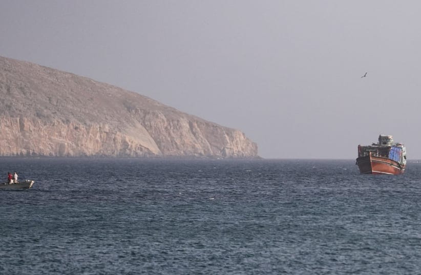 A vessel in the Strait of Hormuz, as seen from Musandam, Oman, July 16, 2026