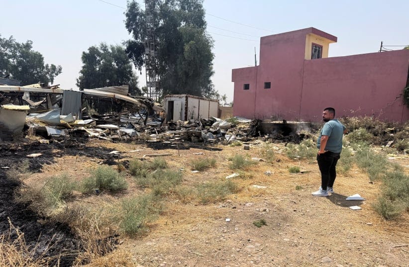 A man looks on near damage at a site belonging to Iraq's Popular Mobilization Forces (PMF) following airstrikes that the PMF said were carried out by US and Saudi forces, in Bartella, Nineveh province, Iraq, July 29, 2026.