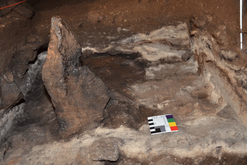 Brown pointy stone inside cave.