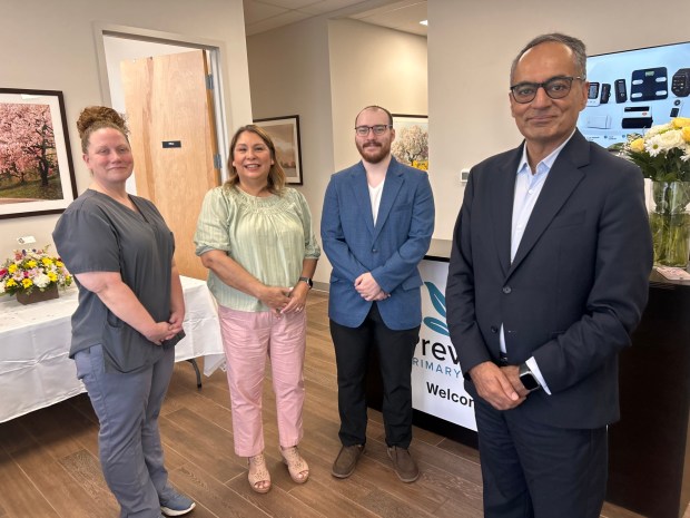 Health care entrepreneur Faisal A. Nawaz, right, with the PrevHealth Ridley staff members, from left, Leanne Eisenhower, office manager; Ruby Parvaiz, director of administration and human resources; and Talyn Xystus, site engineer. (PETE BANNAN-DAILY TIMES)