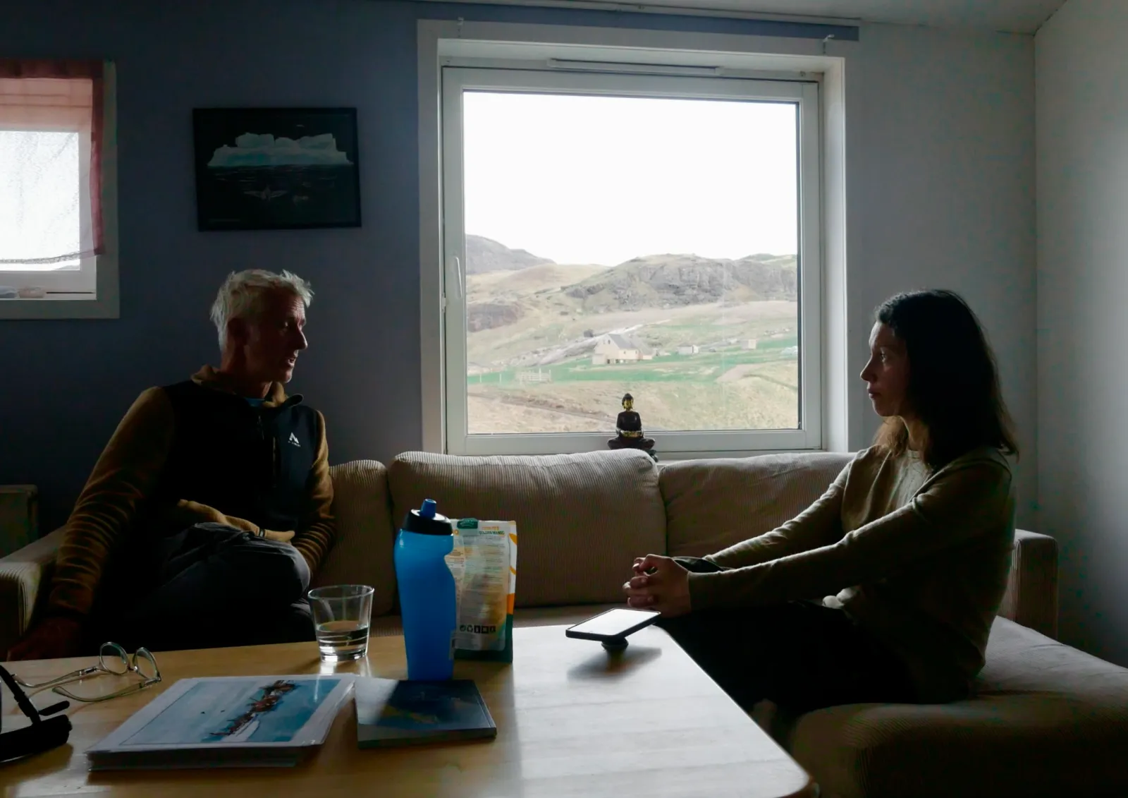 Naasunnguaq Lund (right) chats with a guest, Riding Greenland, Qassiarsuk.