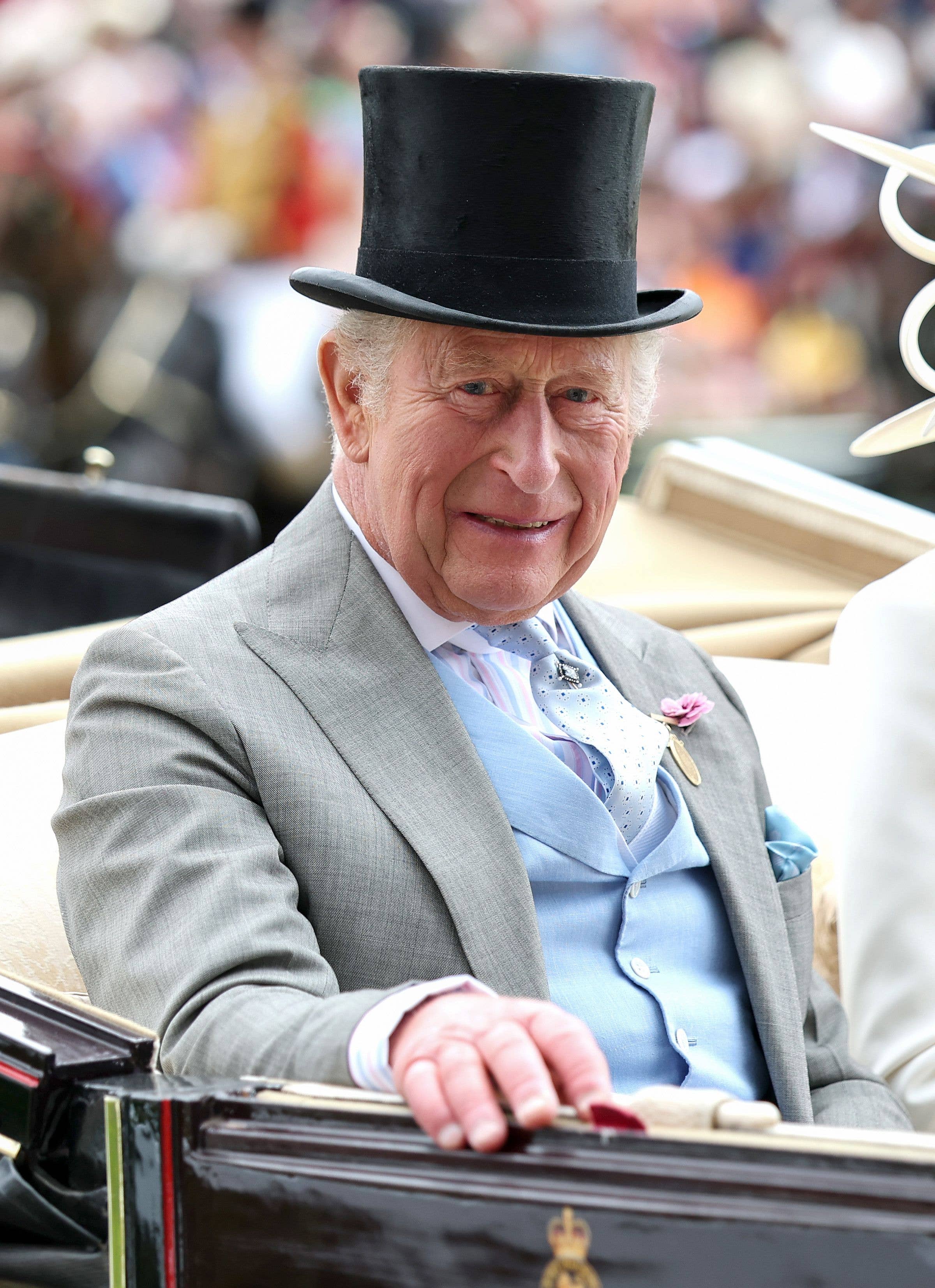 King Charles in a top hat and carriage