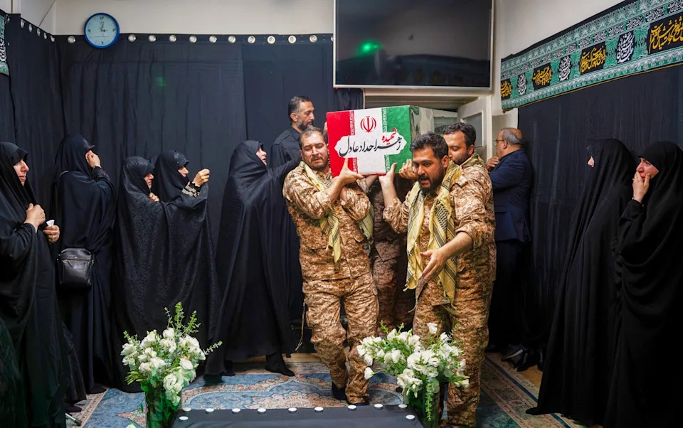 Mourners carry the coffin of Zahra Haddad-Adel, the wife of the new Iranian supreme leader, who was among the other victims of the air strike that killed her father-in-law