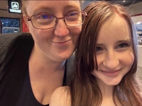A woman with glasses and her niece selfie.