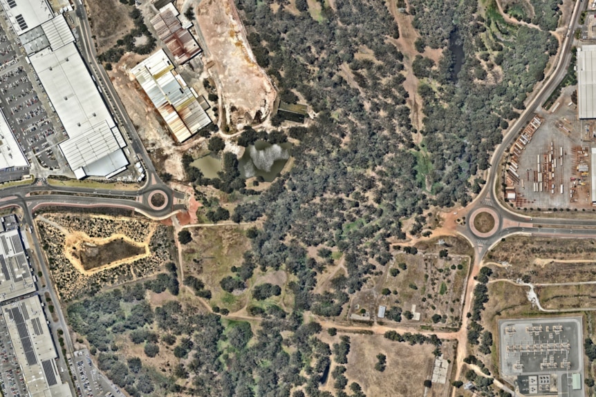 An aerial picture of a river bed with two roads leading up to it