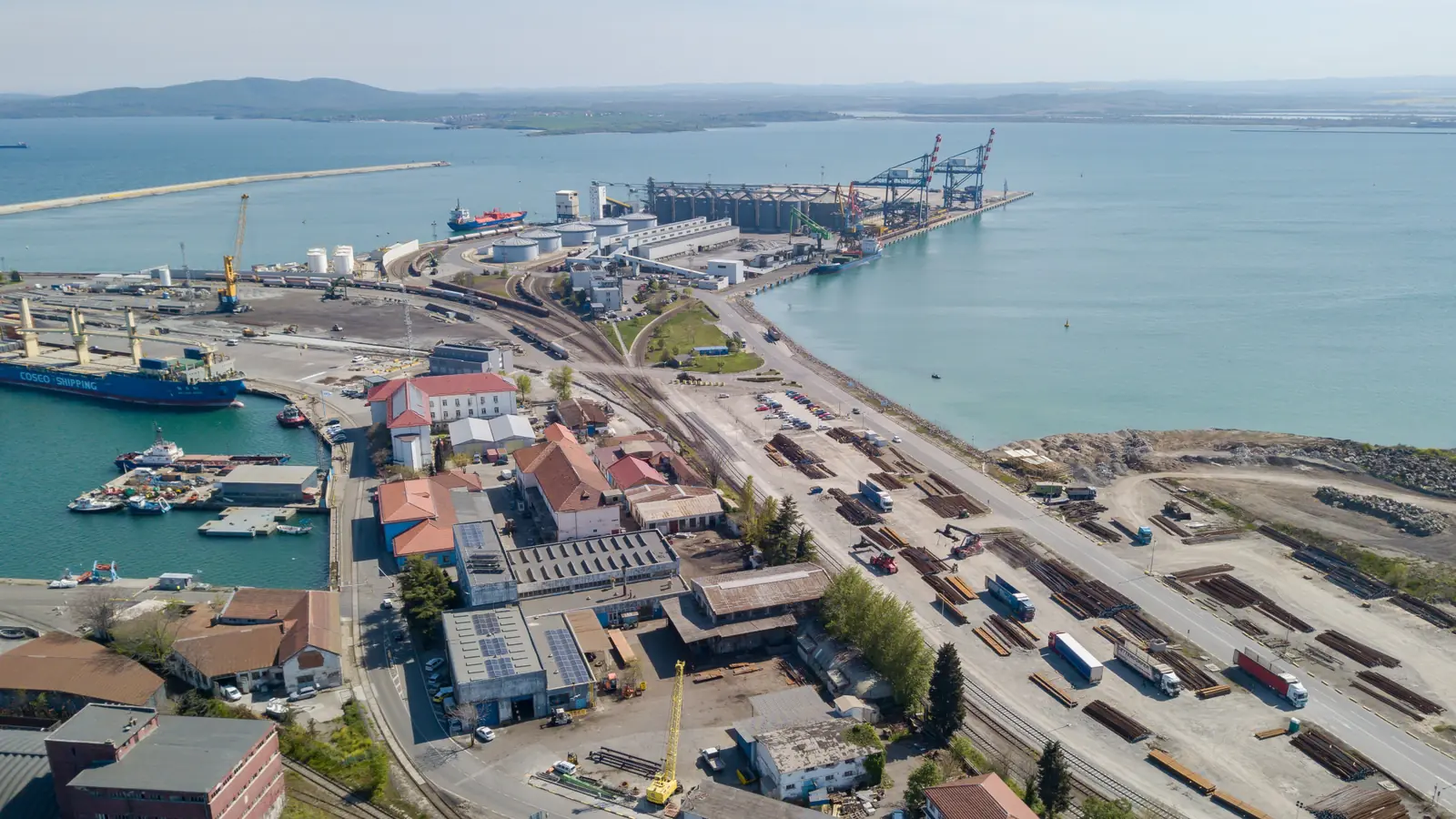 Aerial view of a Bulgarian port with railway sidings, roads and cargo-handling facilities