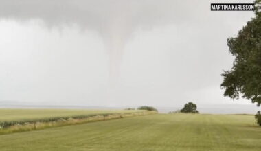 A rare double tornado whirls through a field in Sweden