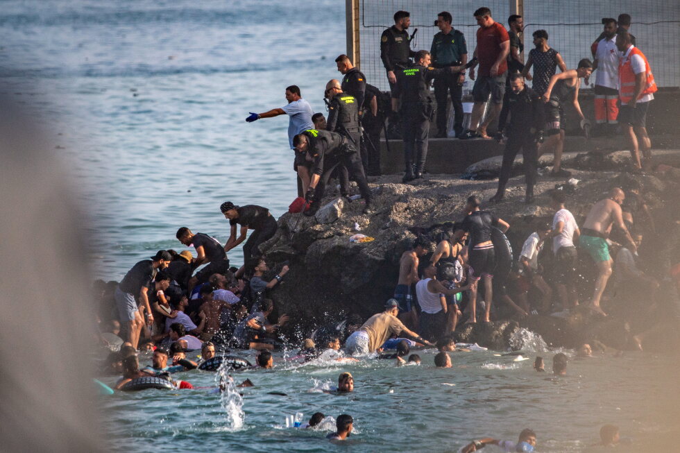 Thousands break through border separating Spain's Ceuta from Morocco