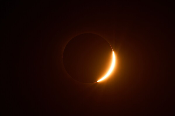 The moon moves out of the sun during a total solar eclipse is seen from Berlanga de Duero, central Spain, Wednesday, Aug. 12, 2026. (AP Photo/Bernat Armangue)