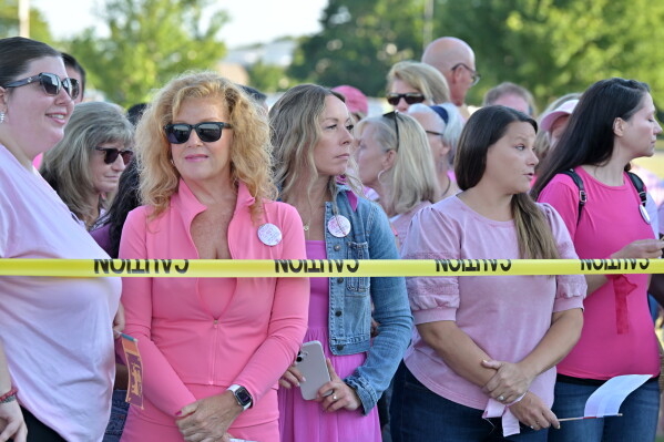 Supporters of Lindsay Clancy stand outside Plymouth Superior Court where Clancy is on trial for the death of her three children, Thursday, Aug. 20, 2026., in Plymouth, Mass. (AP Photo/Josh Reynolds )