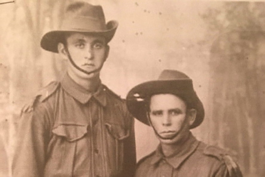 A sepia hphotograph of two young men in Australian military uniform.