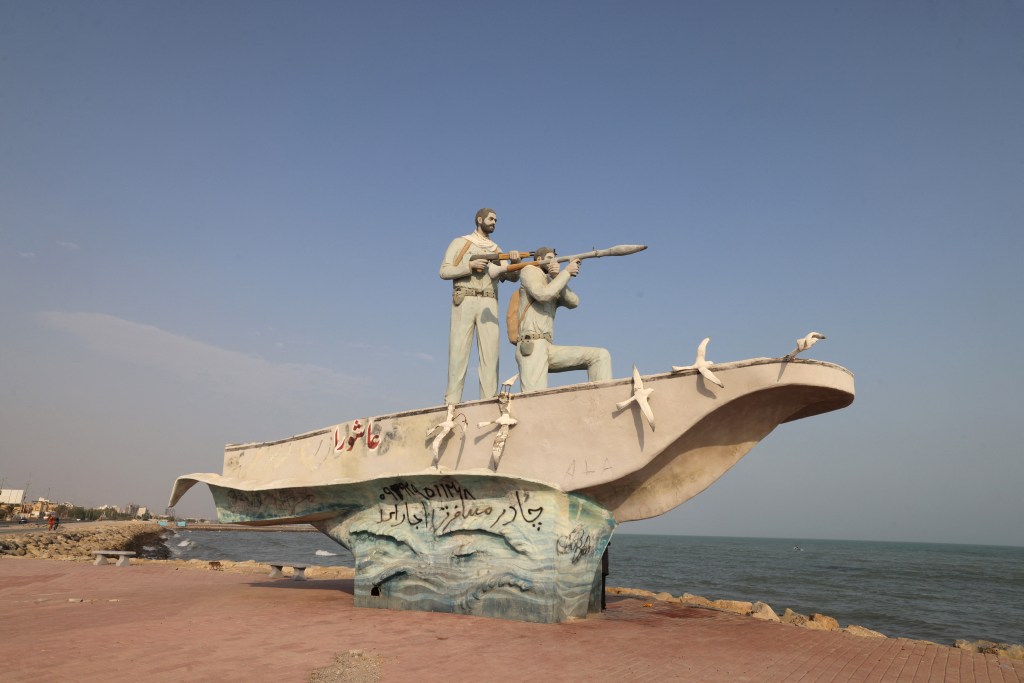 A sculpture depicting two armed soldiers in a boat overlooking the Strait of Hormuz in Bandar Abbas, southern Iran.