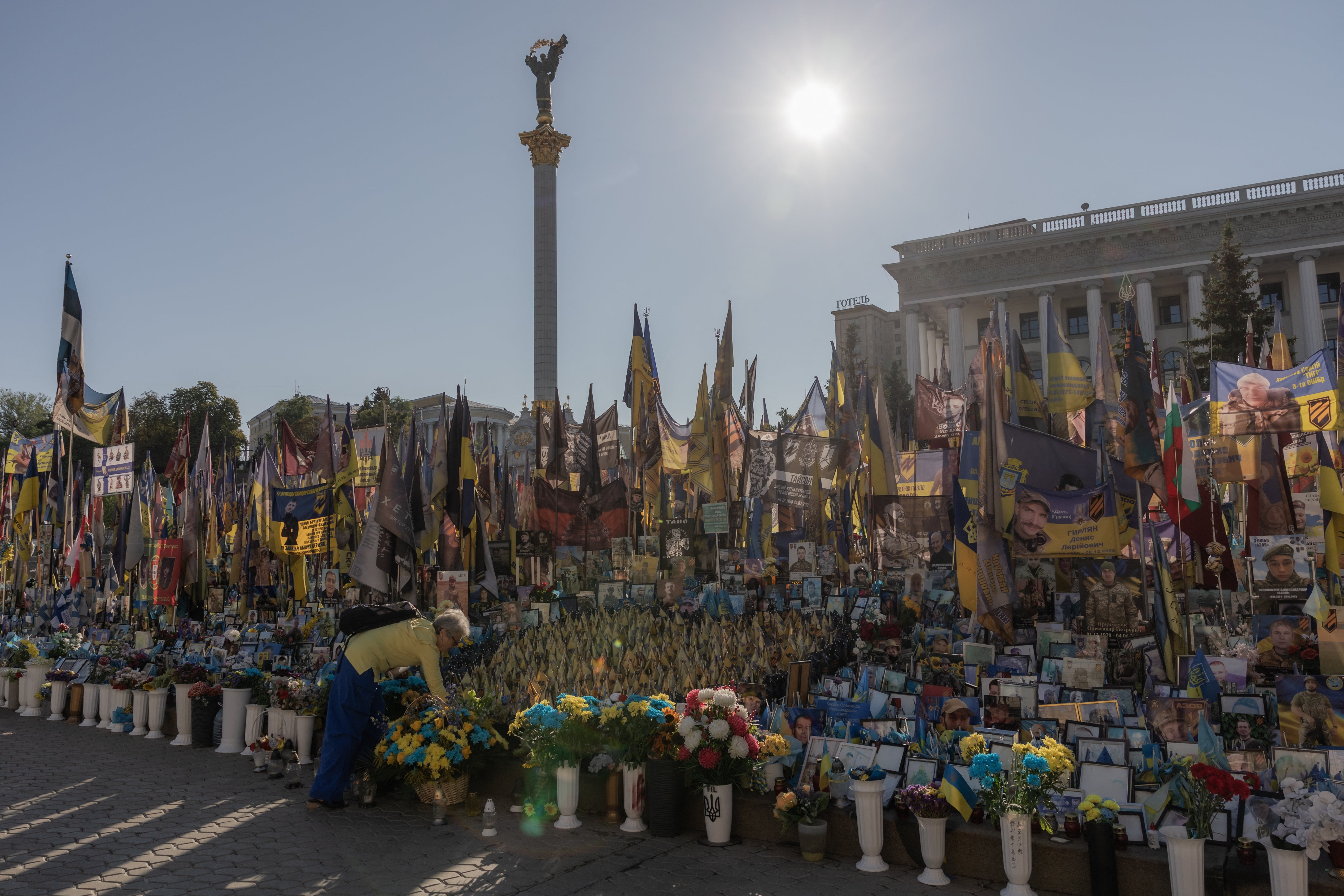 A person visits the makeshift memorial for fallen Ukrainian and foreign soldiers during the Independence Day of Ukraine, on Independence Square in Kyiv on August 24, 2026