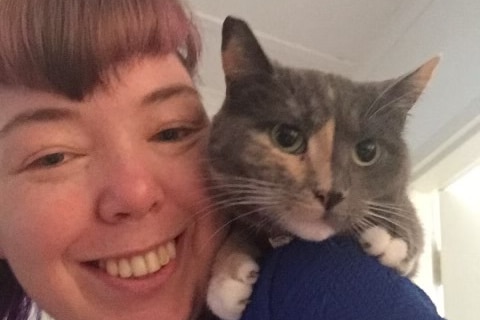 Kate Sylvia with a cat.
