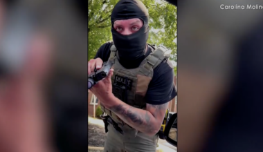 ICE agent seen on video pointing gun at woman, conflicting with government's narrative