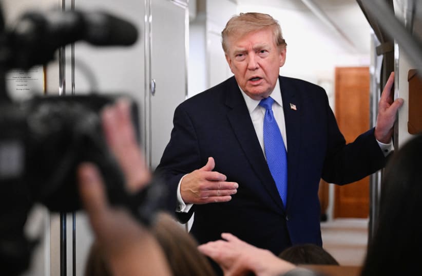US President Donald Trump speaks to the media aboard Air Force One en route to Joint Base Andrews, in Maryland, US, August 2, 2026. 