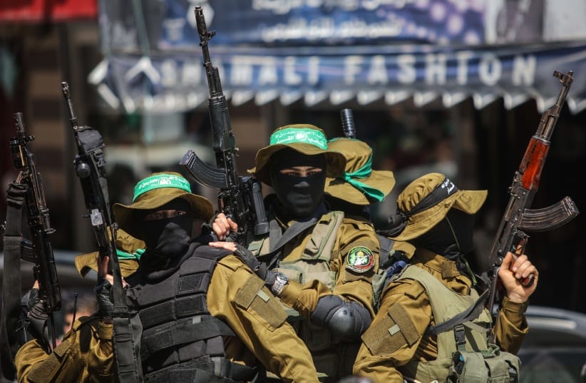 Masked gunmen from the Qassam brigade, the militia wing of Hamas, attend the funeral of Mazen Faqha in Gaza City, Saturday, March, 25, 2017. The former Palestinian prisoner whom Israel sent to Gaza after his release was found shot dead at the entrance of his house in Gaza City.