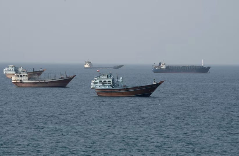 Vessels near the Strait of Hormuz, as seen from Musandam, Oman, August 17, 2026. 