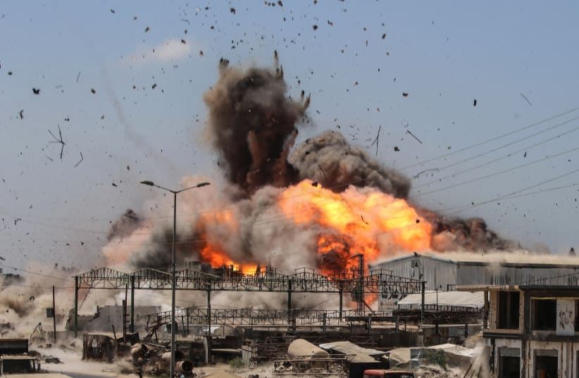 Smoke and a fire ball rise during an Israeli strike, carried out after the military warned Palestinian residents to evacuate the area of al-Zawayda, in the central Gaza Strip, on August 23, 2026.