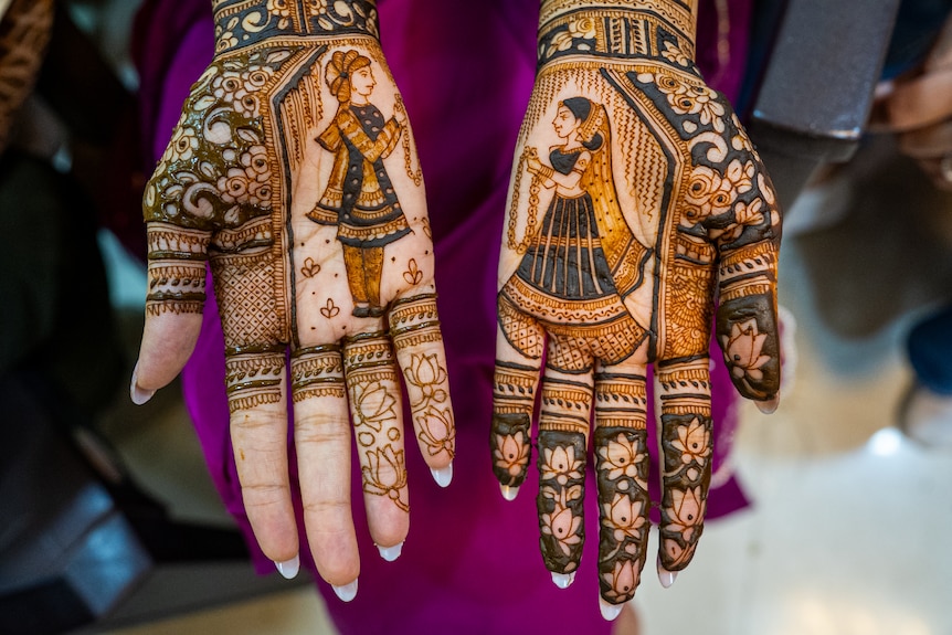 A bride's hands adorned with henna.