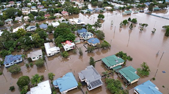 Houses in Lismore, northern NSW, surrounded by flood water in March.