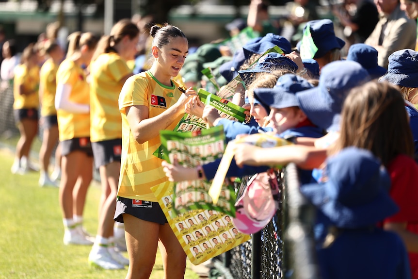 Monique Conti of Australia with fans.