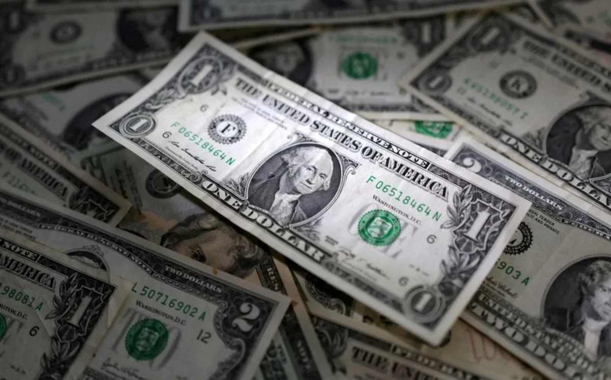 Dollar flat after data as focus shifts to Jackson Hole