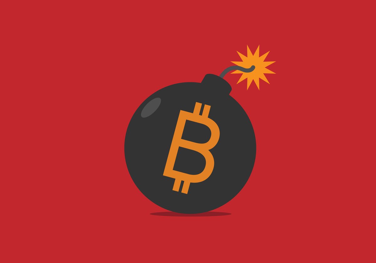 A bomb with a lit fuse is labeled with the Bitcoin logo.