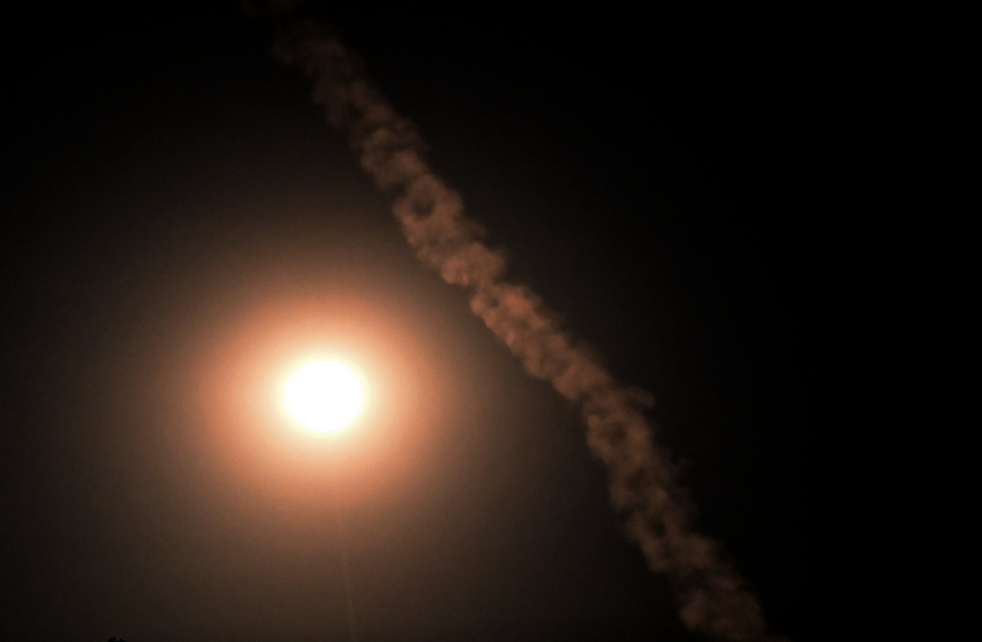 A smoke trail from a projectile is seen during a Russian aerial attack in Kyiv