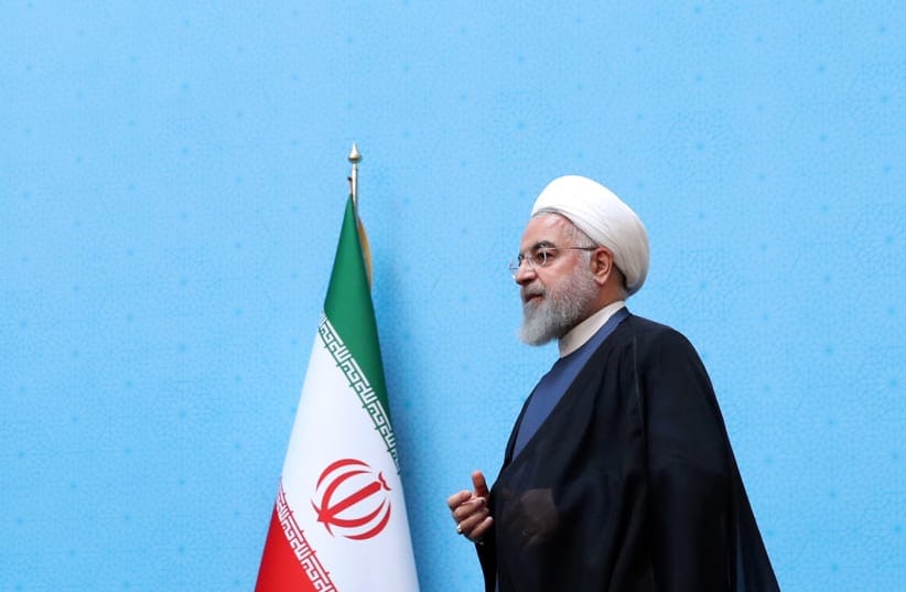 Iranian President Hassan Rouhani walks to deliver a speech during the Conference of Government’s Achievements in Developing Rural Infrastructure in Tehran, Iran, August 26, 2019. 