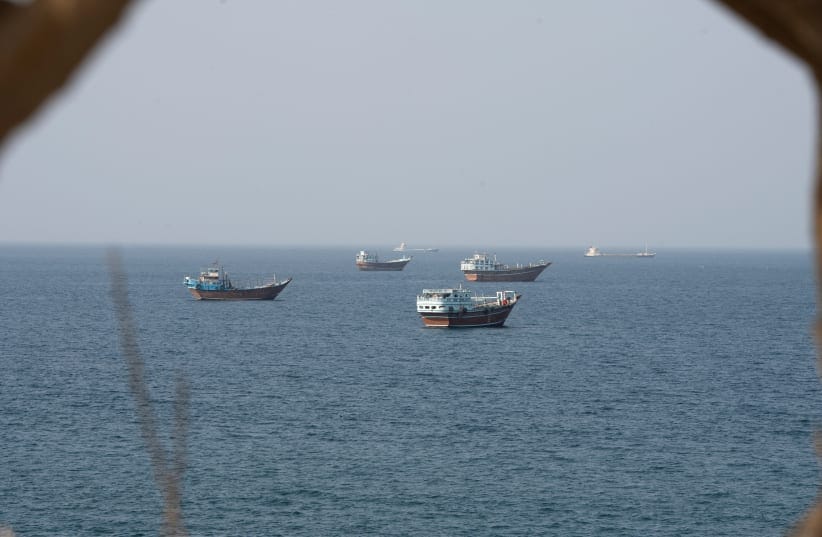 Vessels near the Strait of Hormuz, as seen from Musandam, Oman, August 17, 2026. 