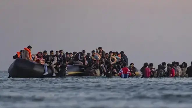 Migrants sit on a dinghy as they attempt to cross the English Channel from Gravelines, in an image from earlier this summer.